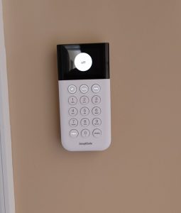 SimpliSafe keypad mounted on wall