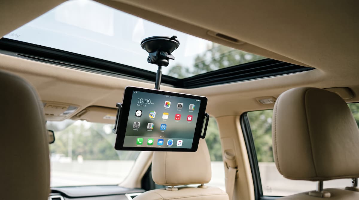 Sunroof Tablet Mount Tablet mounted to vehicle sunroof for rear seat viewing