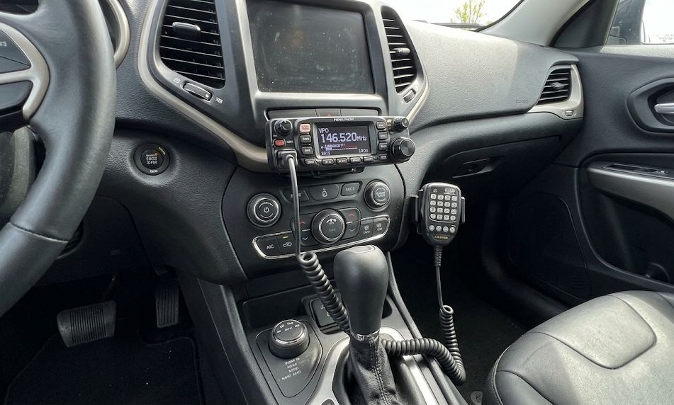 HAM radio with microphone mounted in a car