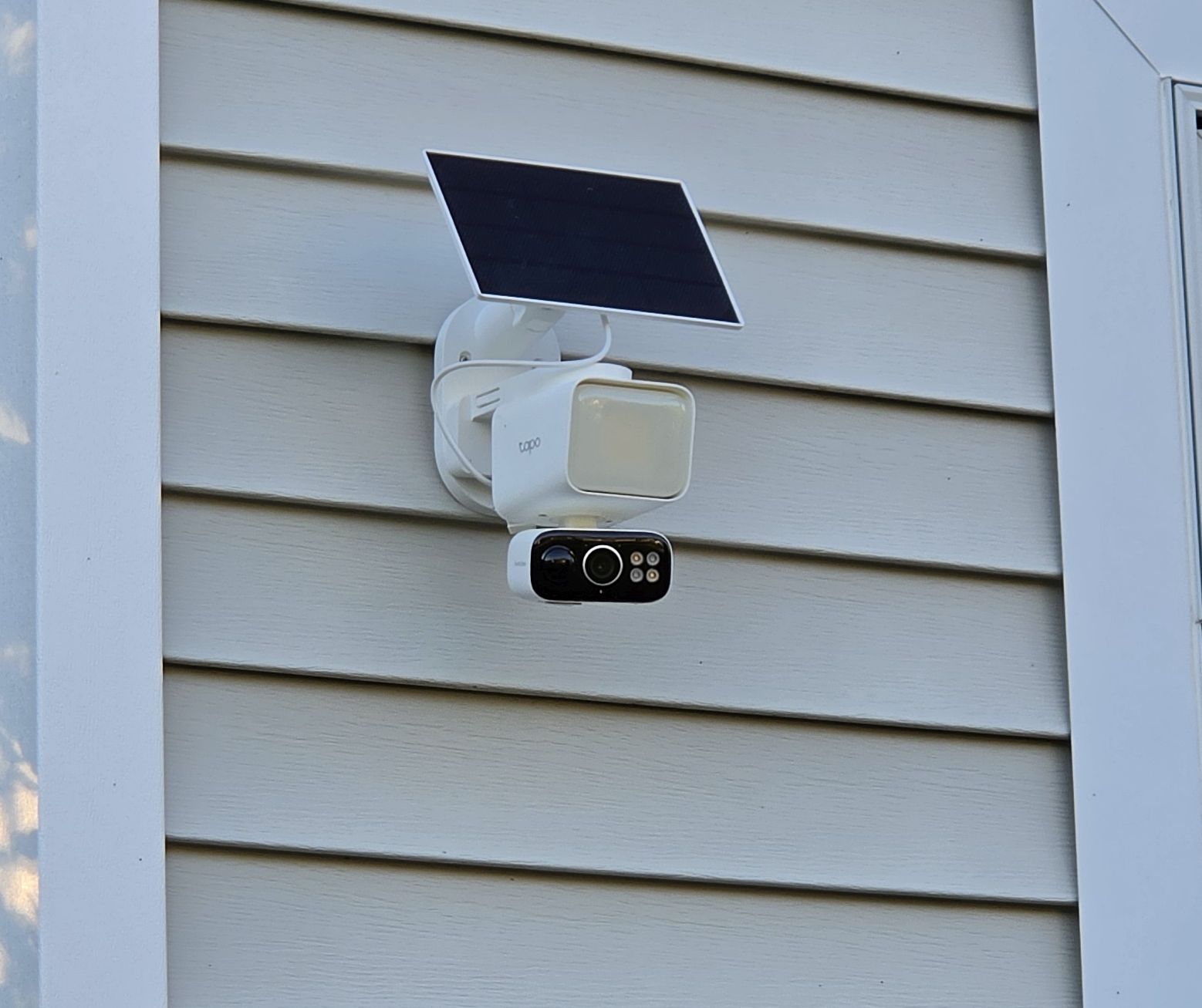 TP-Link Tapo C615F floodlight camera mounted on vinyl siding