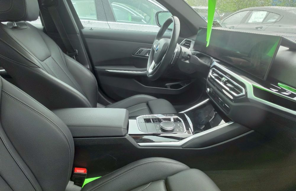 BMW 3 Series interior showing dashboard and infotainment screen