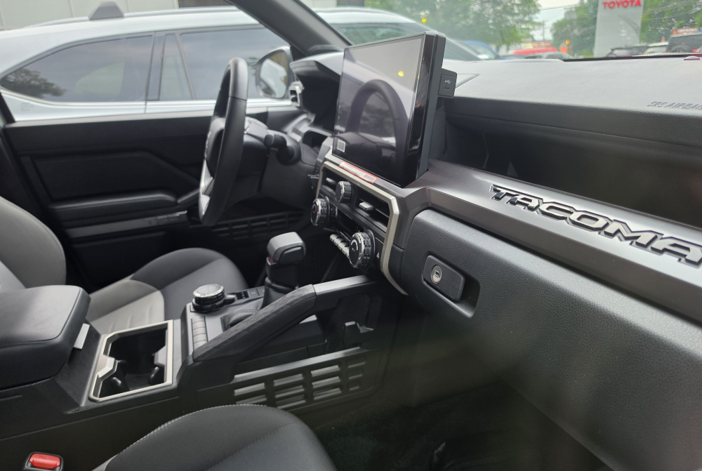 Toyota Tacoma phone mount interior showing dashboard and center touchscreen