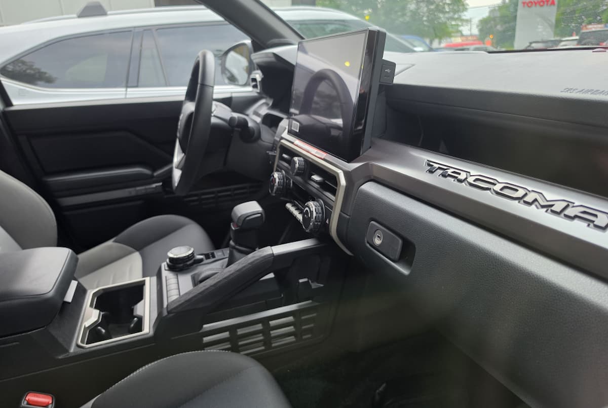 Toyota Tacoma phone mount interior showing dashboard and center touchscreen