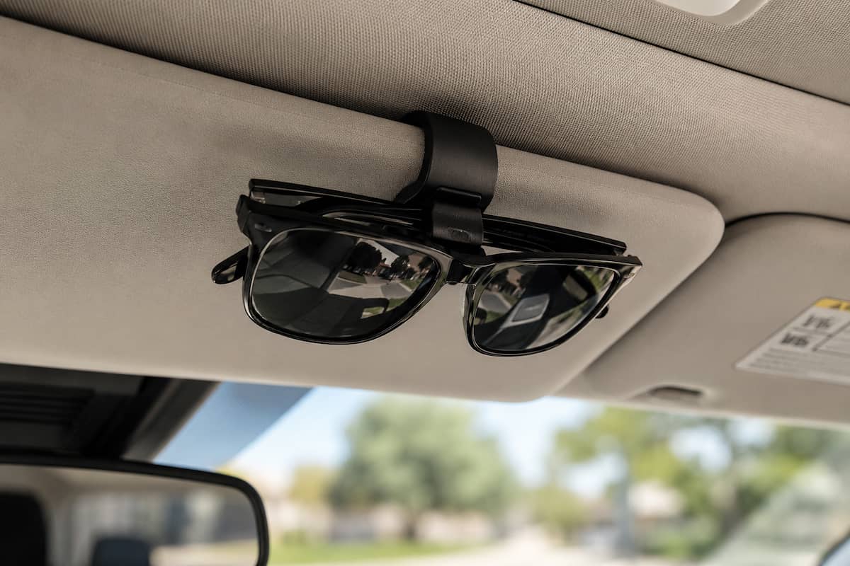 Car sunglasses holder mounted on a vehicle visor