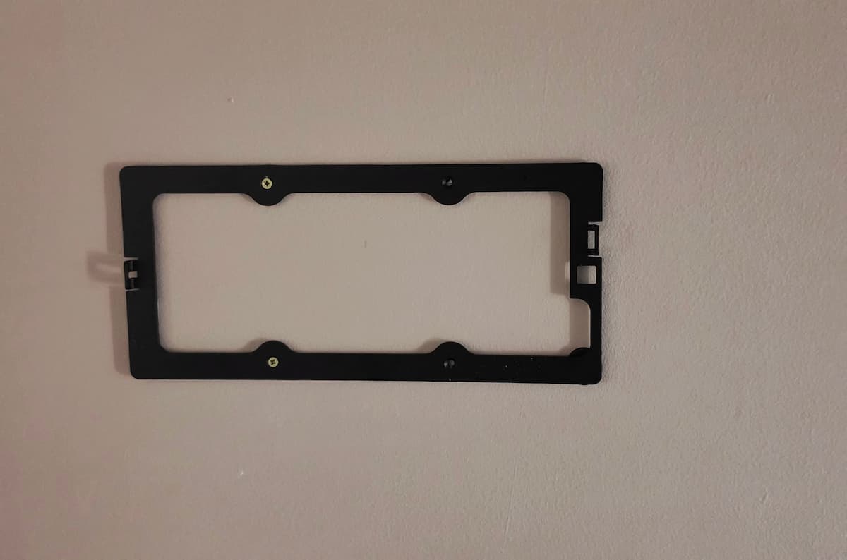 Displine Companion Wall 2.0 Install Displine Companion Wall 2.0 rear mounting bracket screwed horizontally into drywall above a 2-gang light switch